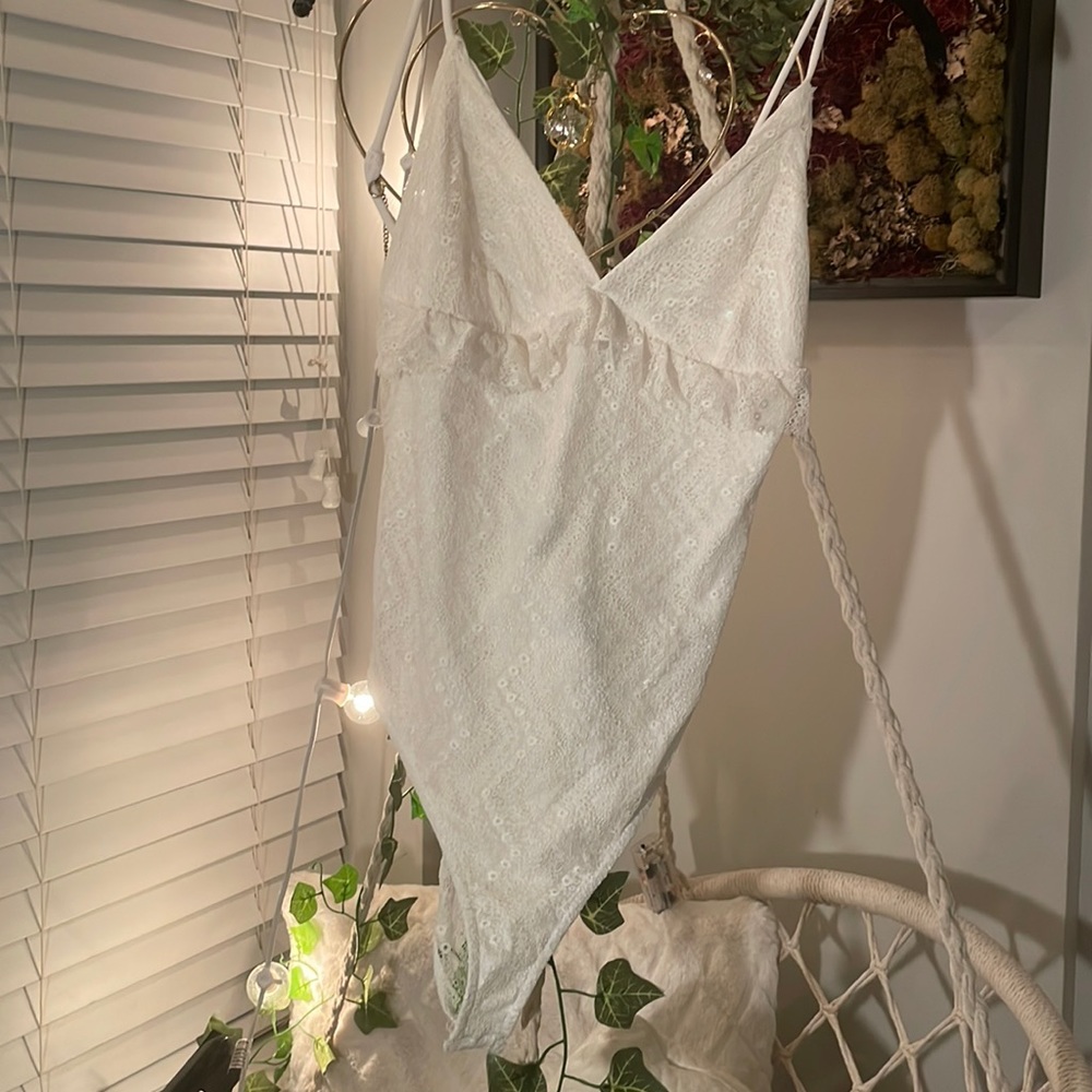 White lace Jumpsuit with button clasp on bottom